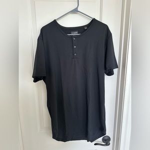 Black elongated Henley t shirt with a scalloped hem